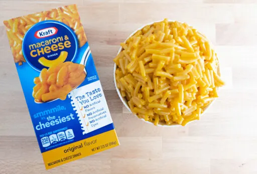 Kraft Mac & Cheese box with a bowl of mac and cheese.