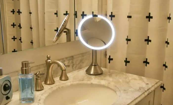 SimpleHuman sensor mirror on bathroom counter