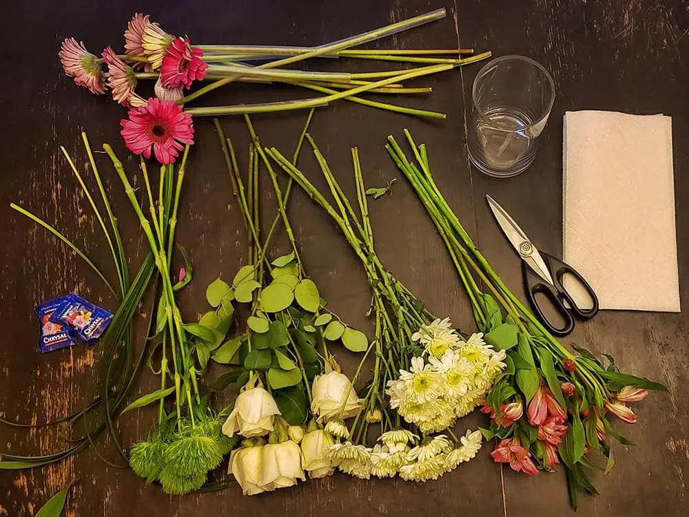 Flower arranging supplies on a table.