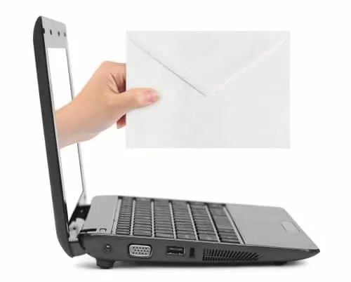 Envelope and hand coming out of a laptop screen