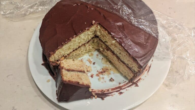 Banana Buttermilk Cake with a couple slices missing.