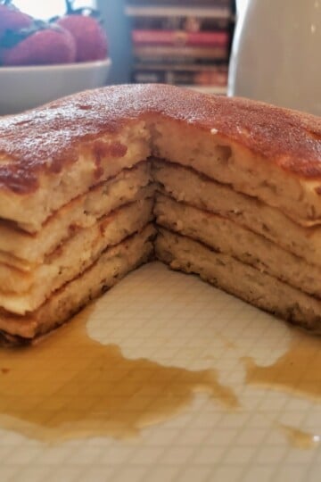 A stack of pancakes with syrup.